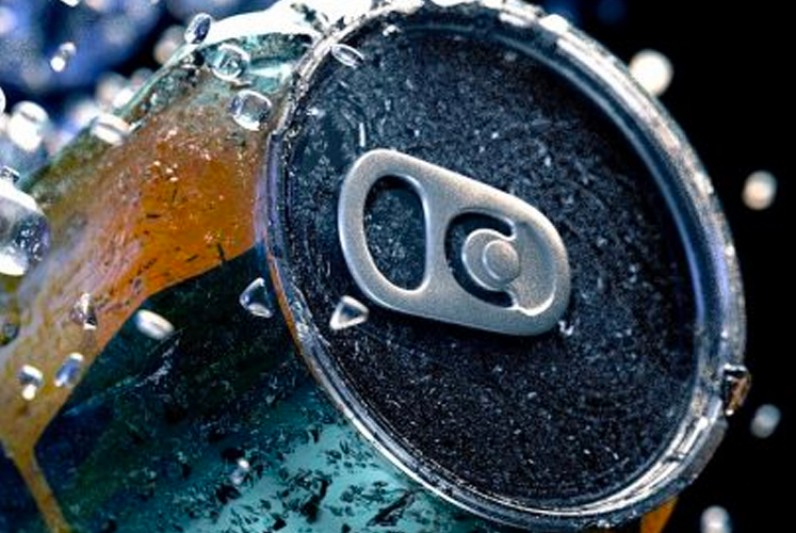 A drinks can surrounding by shattered ice